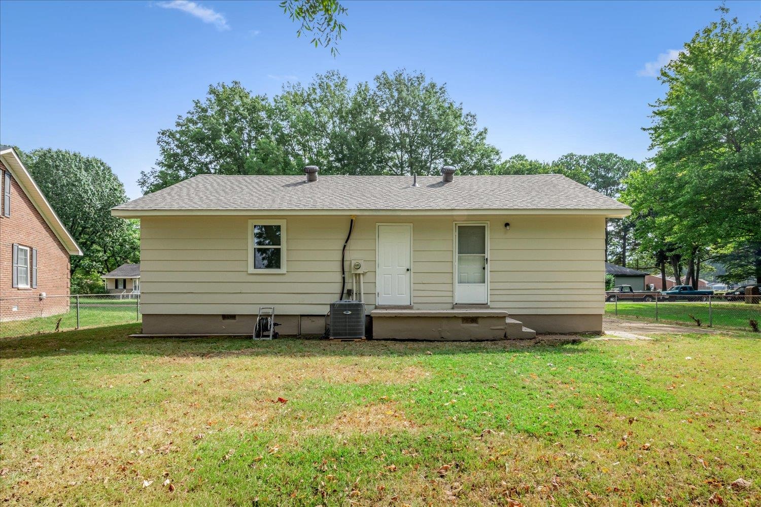179 Harris Cove Collierville, TN 38017 - Photo 21 of 25 Rear view of house featuring roof with shingles and crawl space