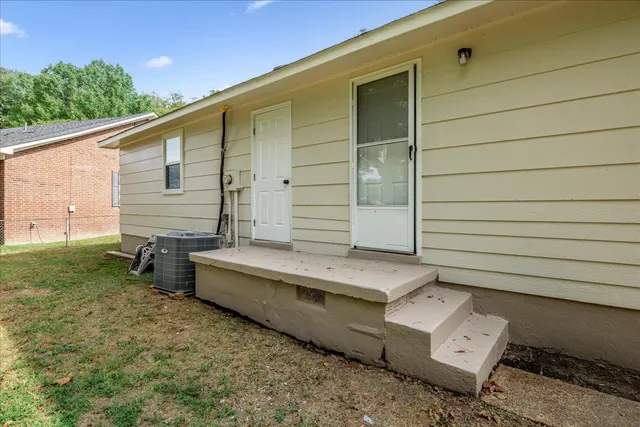 a backyard of a house with outdoor seating
