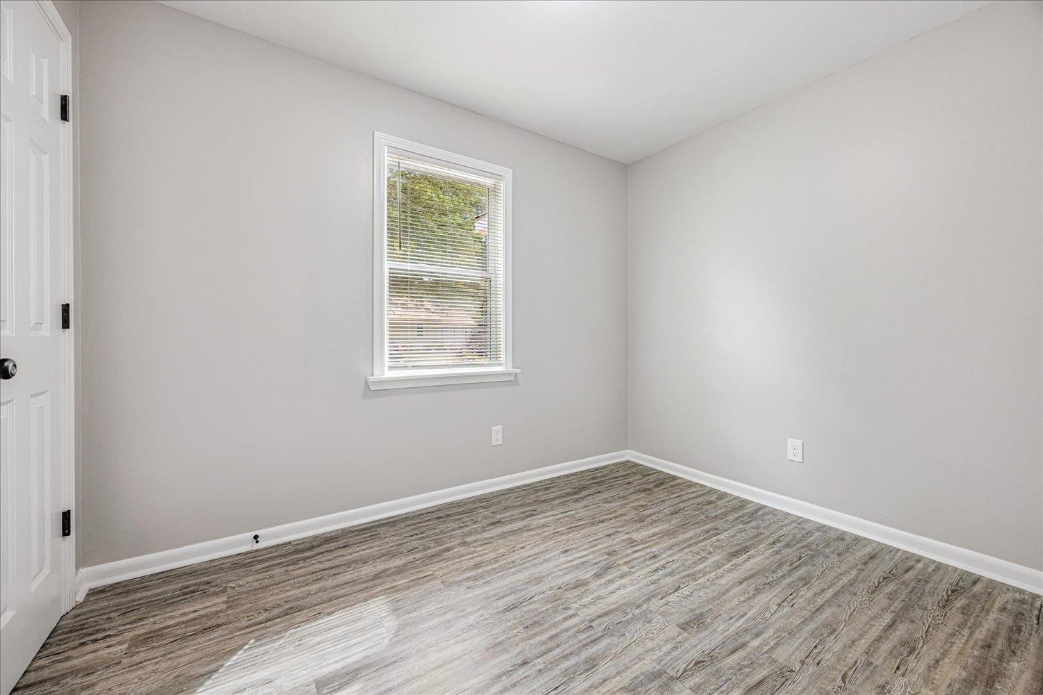 179 Harris Cove Collierville, TN 38017 - Photo 10 of 25 Unfurnished room featuring wood finished floors