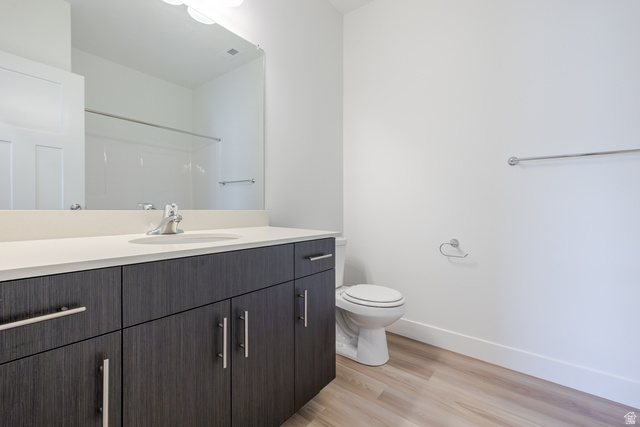 675 West 4500th South, Unit P201 Mapleton, UT 84664 - Photo 6 of 16 Bathroom featuring a dark wood-finish vanity with a light countertop, a single basin sink, and a chrome faucet