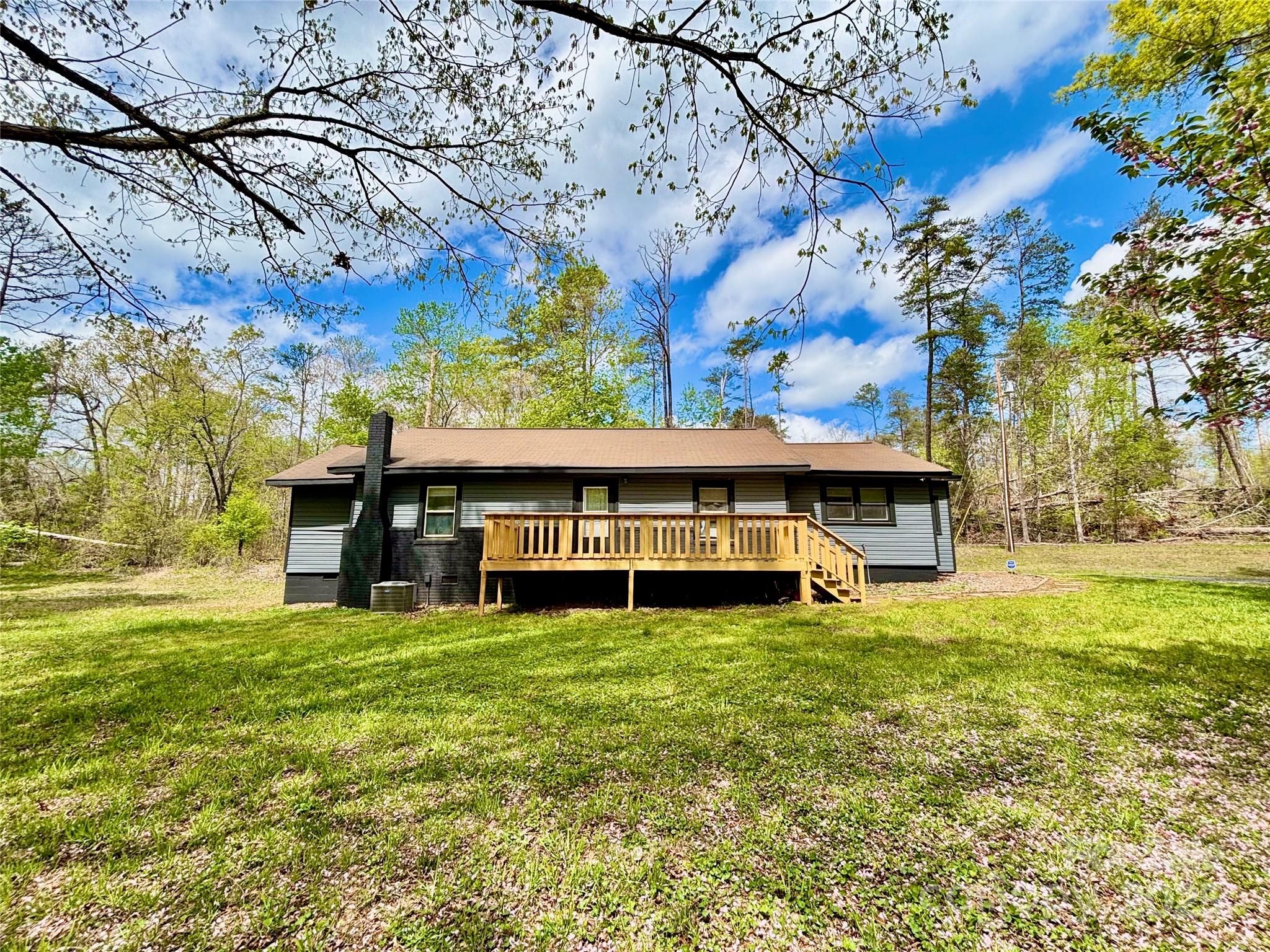 1180 Piney Ridge Road Forest City, NC 28043 - Photo 1 of 35 a view of a large pool with an outdoor space and seating area