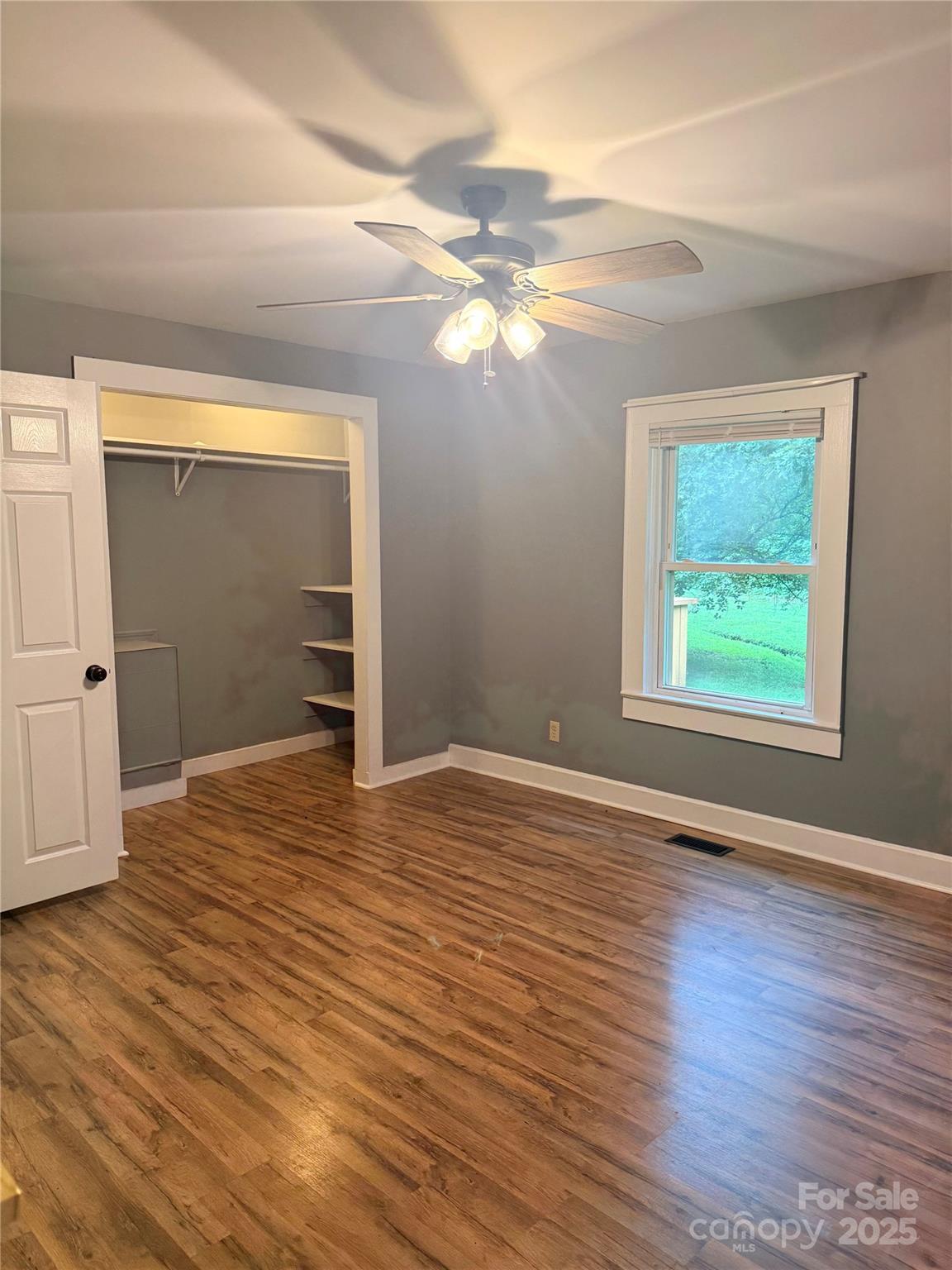 1180 Piney Ridge Road Forest City, NC 28043 - Photo 27 of 35 a view of empty room with wooden floor and fan