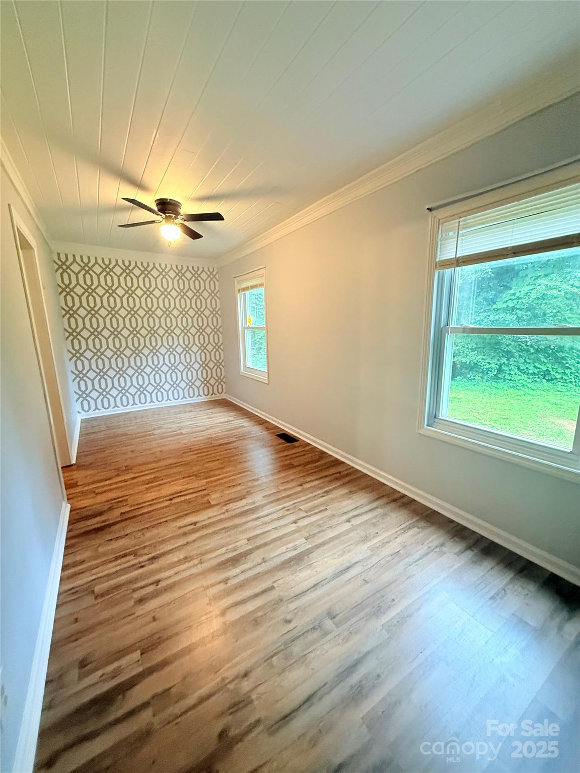 1180 Piney Ridge Road Forest City, NC 28043 - Photo 28 of 35 a view of an empty room with wooden floor and a window