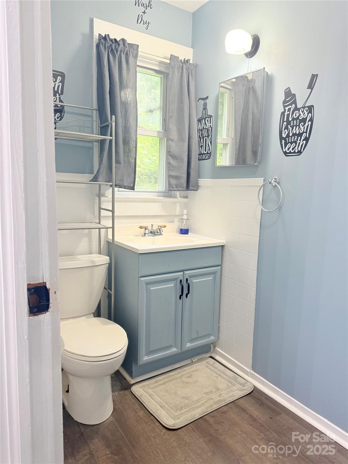 1180 Piney Ridge Road Forest City, NC 28043 - Photo 30 of 35 a bathroom with a toilet sink and mirror