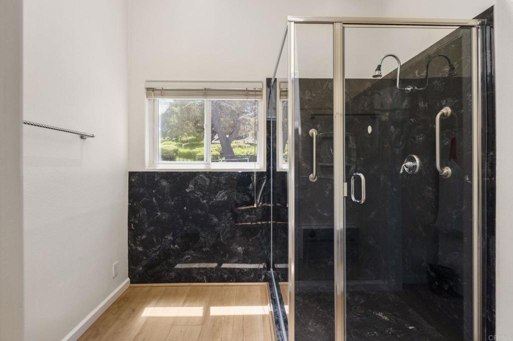 4939 Tilos Way Oceanside, CA 92056 - Photo 25 of 49 a bathroom with a shower