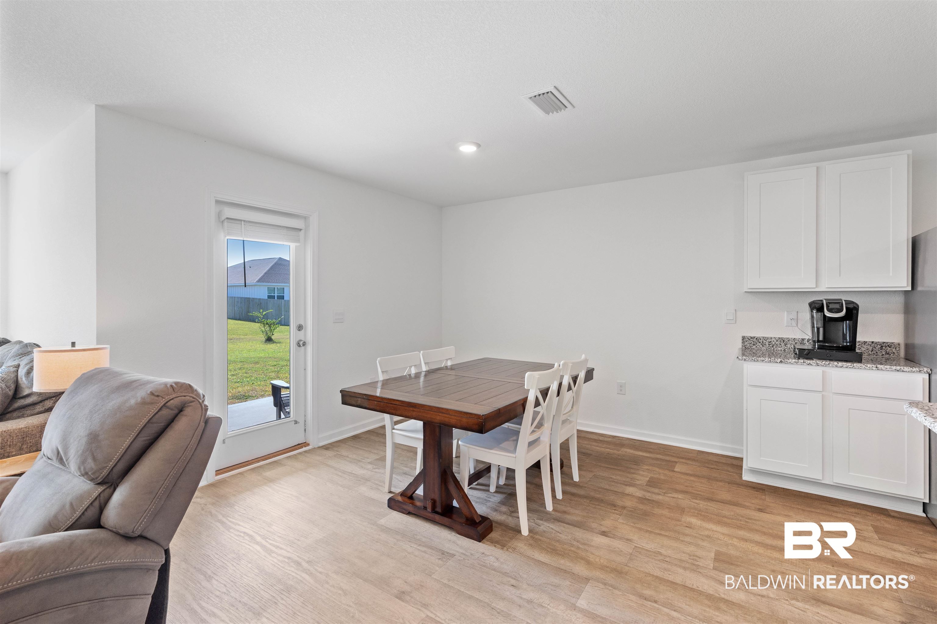 15030 Forsythia Loop Silverhill, AL 36576 - Photo 12 of 33 Dining space with light wood-style floors and recessed lighting