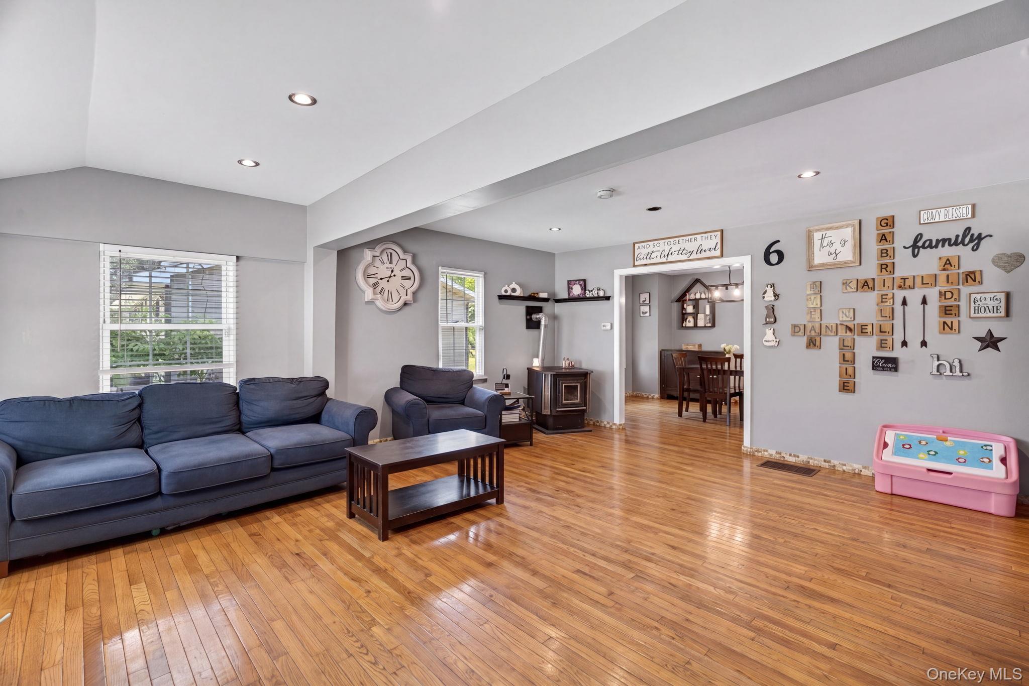 7 Walnut Street Poughkeepsie, NY 12601 - Photo 9 of 30 Generously sized and perfect for both everyday living and entertaining, the room seamlessly opens into the dining area, creating an airy, open-concept feel while still maintaining the charm and coziness Cape Cod homes are known for.