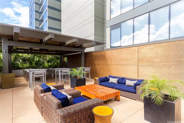 a view of a roof deck with table and chairs