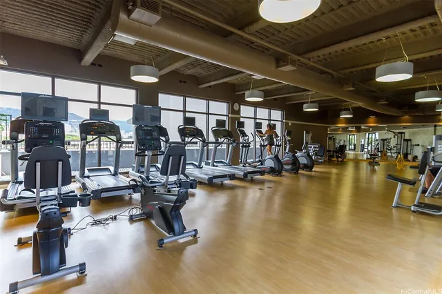 a living room with furniture and a projector screen