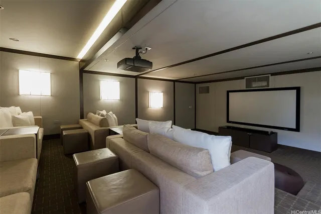 a living room with furniture a projector and a flat screen tv