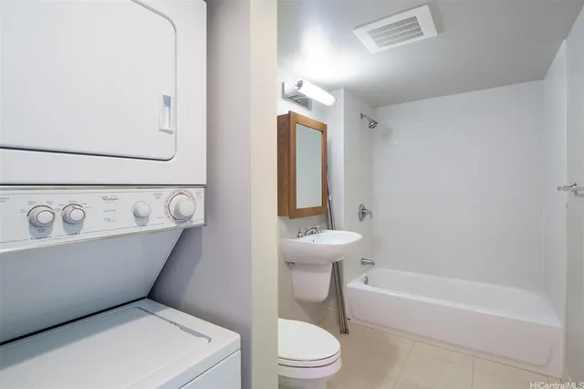 a bathroom with a toilet a sink and bathtub