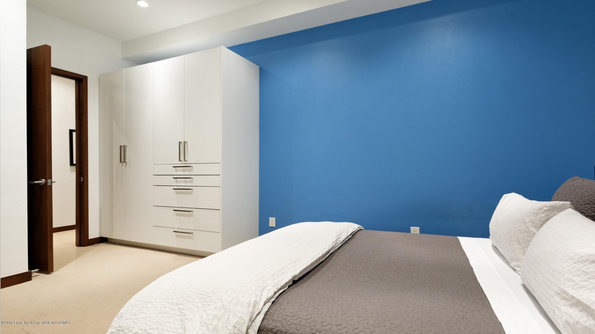 1291 Riverside Drive Aspen, CO 81611 - Photo 15 of 19 a bedroom with a bed and a dresser