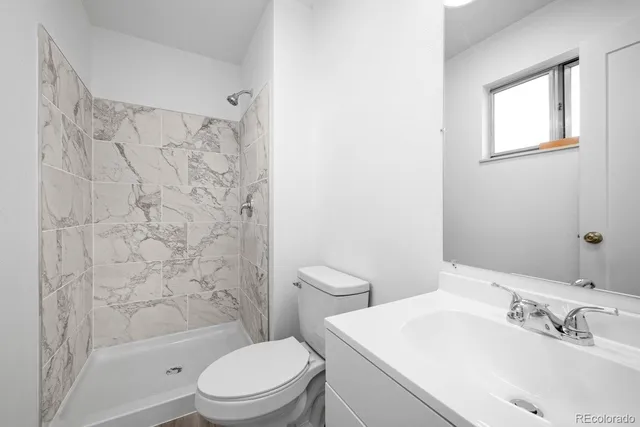 a bathroom with a toilet and a bathtub