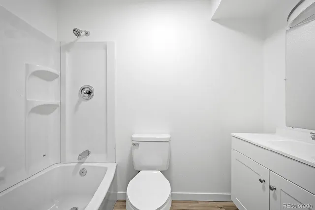 a view of a room with wooden floor and staircase