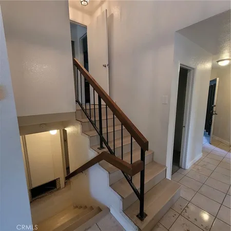a view of a hallway with staircase