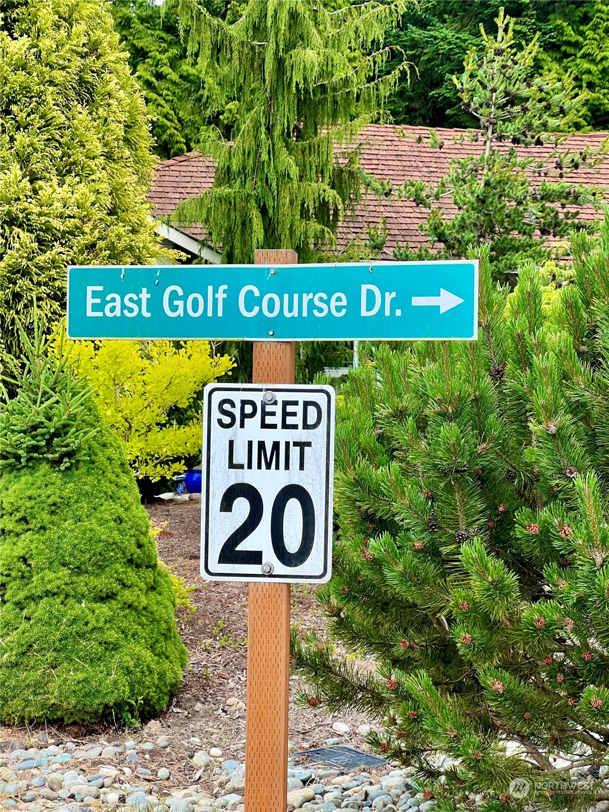 7948 East Golf Course Drive Blaine, WA 98230 - Photo 3 of 11 a street sign that is on a pole