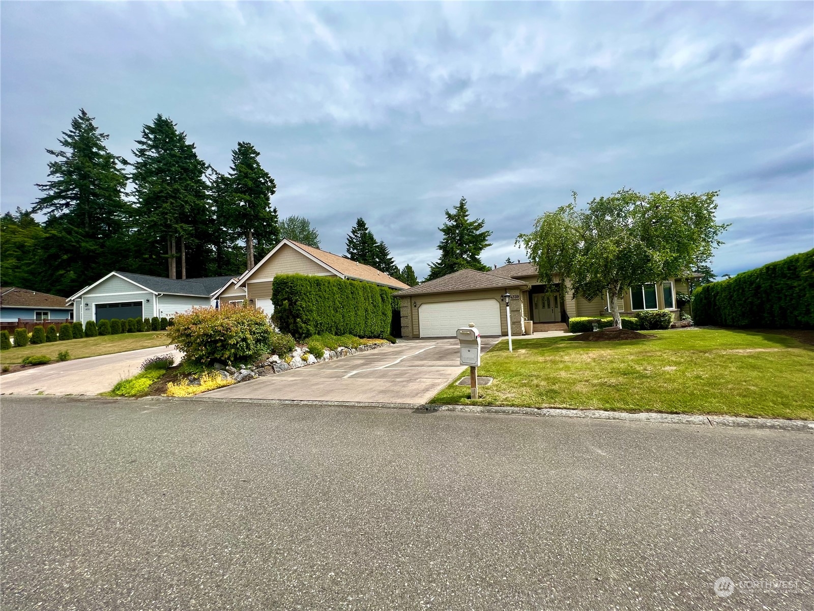 7948 East Golf Course Drive Blaine, WA 98230 - Photo 8 of 11 a view of a house with swimming pool and a yard