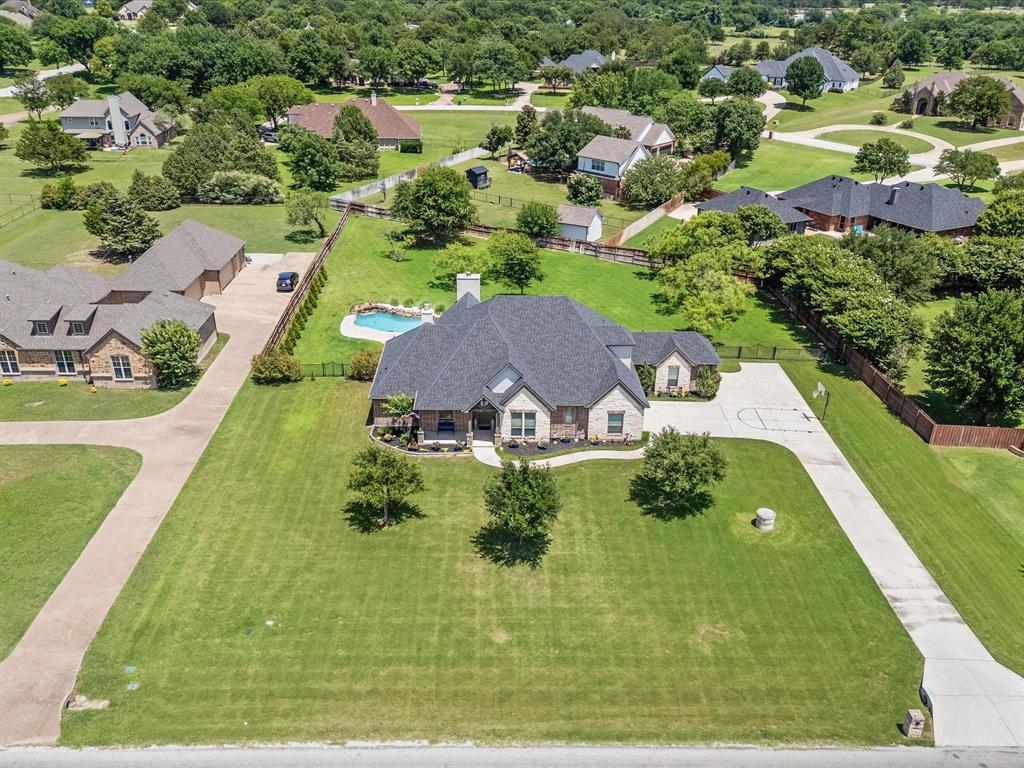 111 Old Base Road Aurora, TX 76078 - Photo 36 of 38 Beautifully updated custom home situated on a one-acre lot in Aurora Vista with mature landscaping, stone accents, and exceptional curb appeal.