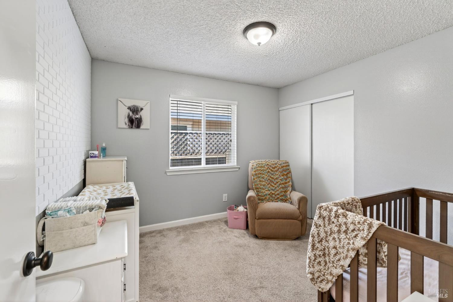 4526 Hillview Court Rohnert Park, CA 94928 - Photo 17 of 28 a bedroom with furniture and a window