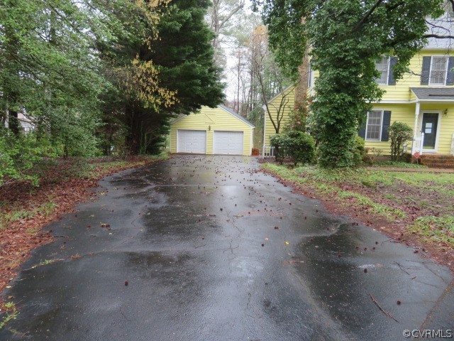 4023 Poplar Grove Road Midlothian, VA 23112 - Photo 4 of 44 a view of a house with a yard and garage