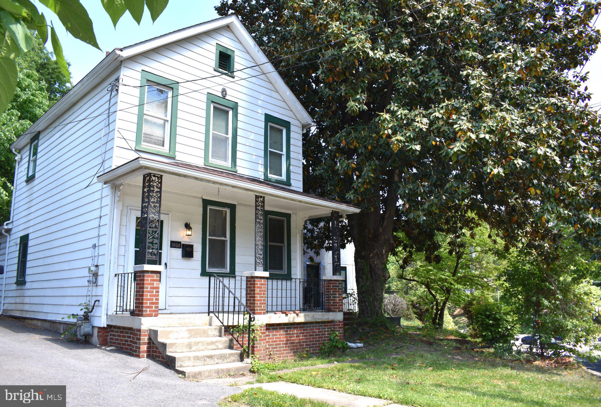 3024 Stanton Road Southeast Washington, DC 20020 - Photo 1 of 13 a front view of a house with garden