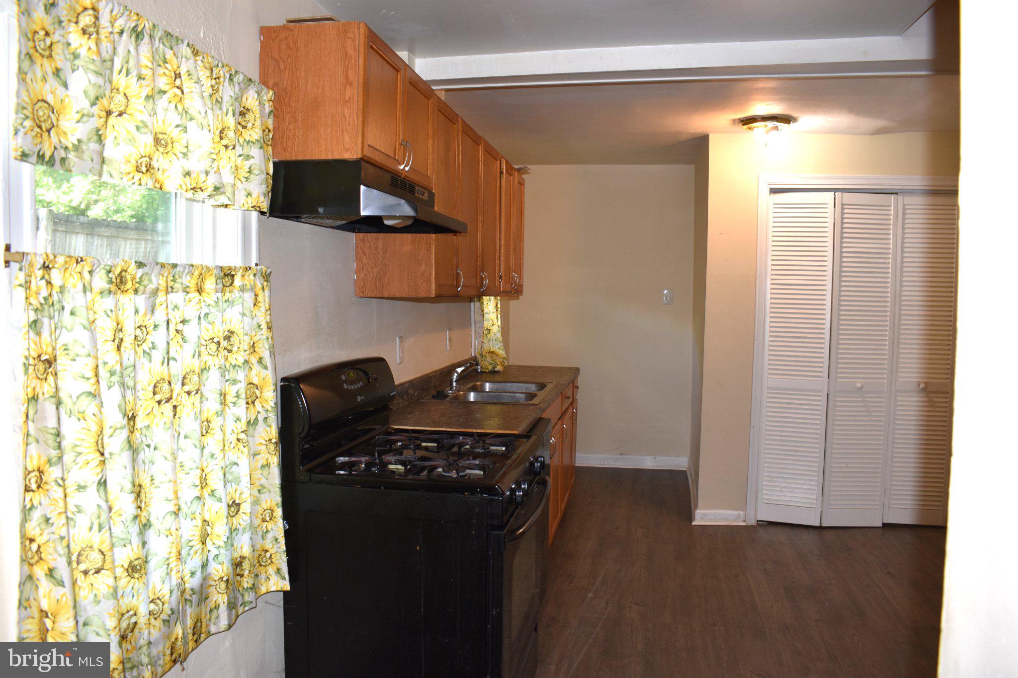 3024 Stanton Road Southeast Washington, DC 20020 - Photo 5 of 13 a kitchen with a sink and a refrigerator