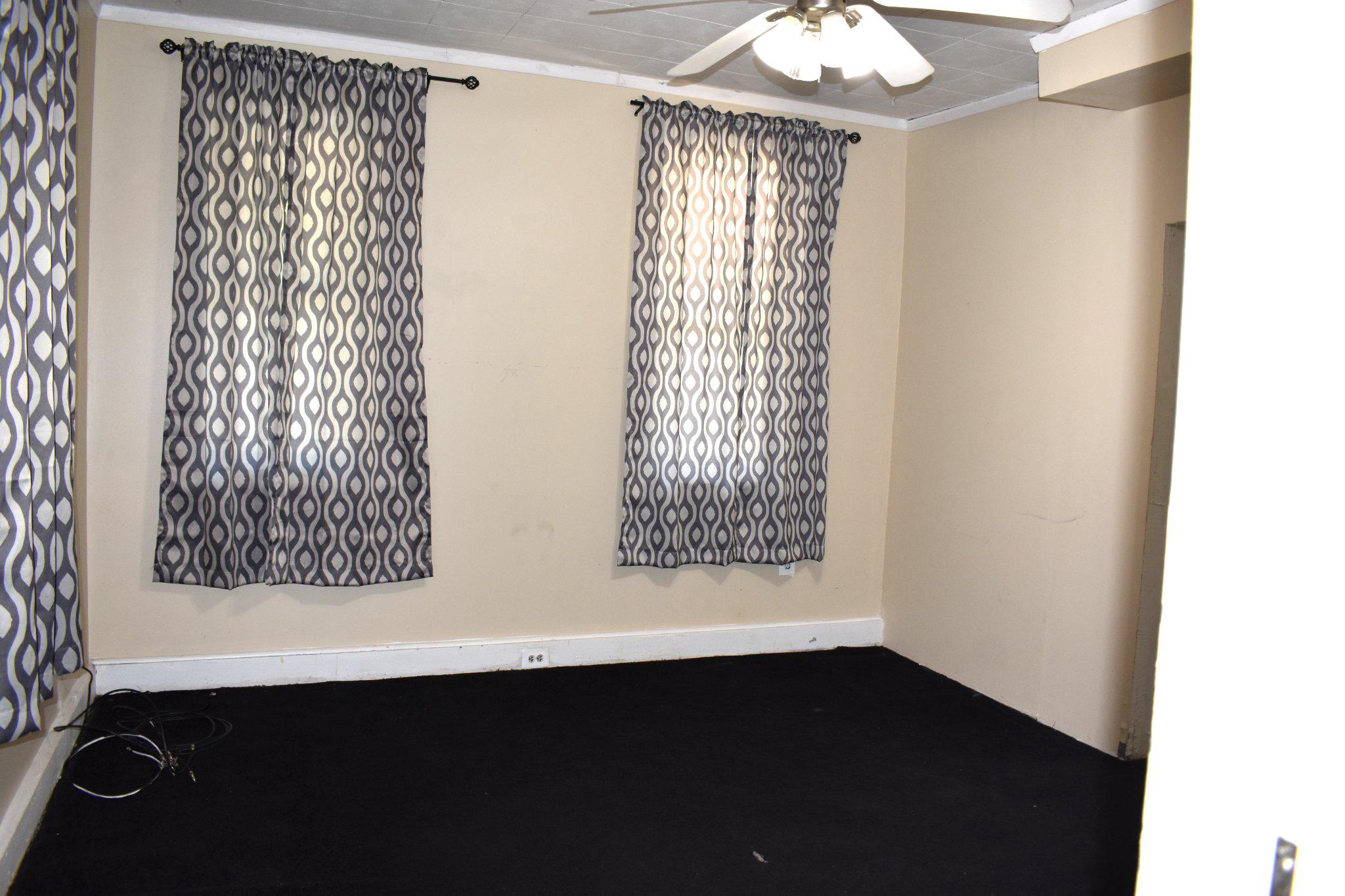 3024 Stanton Road Southeast Washington, DC 20020 - Photo 7 of 13 a view of wooden floor and a chandelier in a room