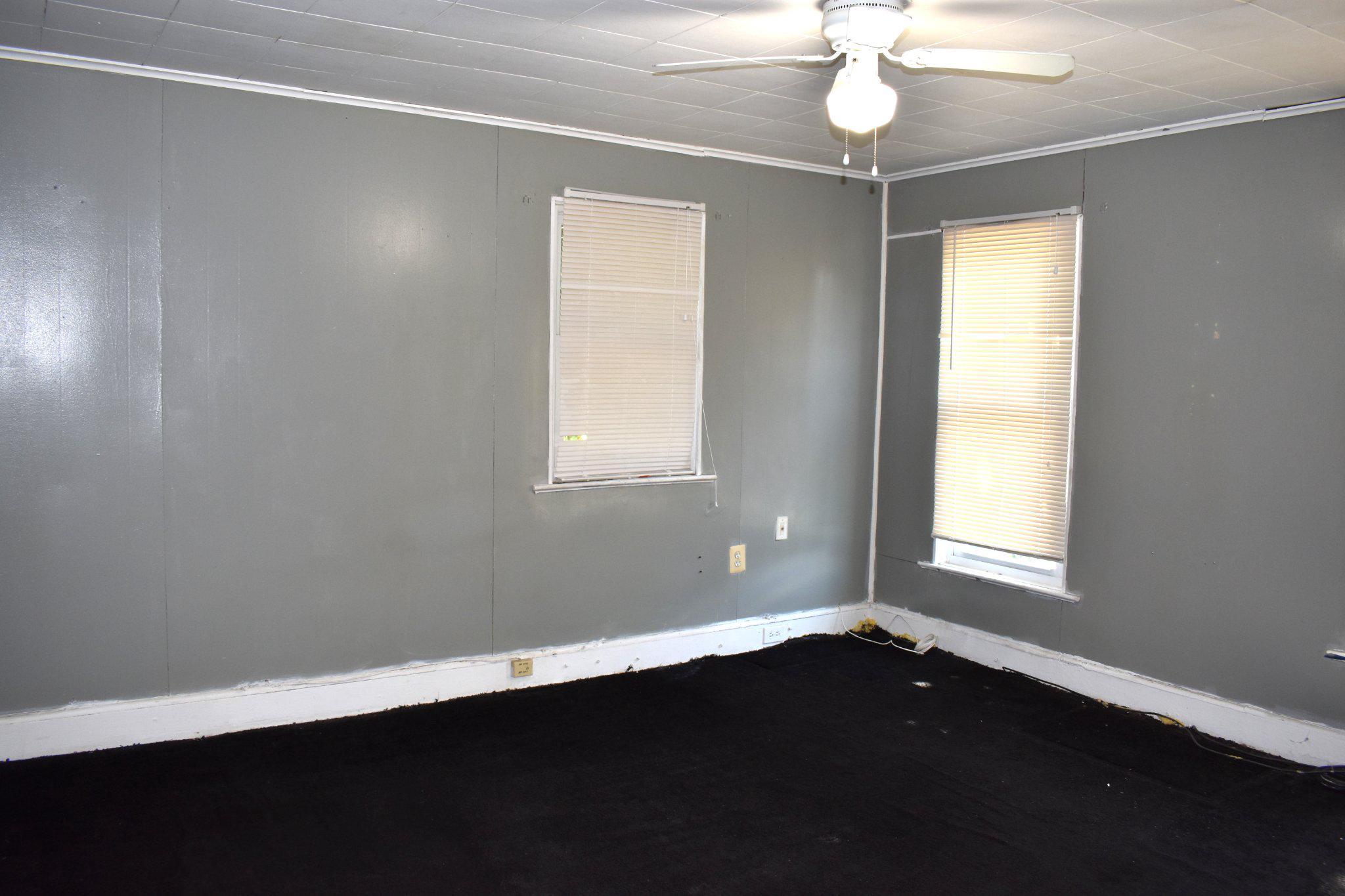 3024 Stanton Road Southeast Washington, DC 20020 - Photo 9 of 13 a view of an empty room with wooden floor and a window