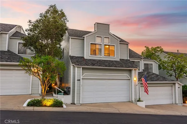 a front view of a house with a garage