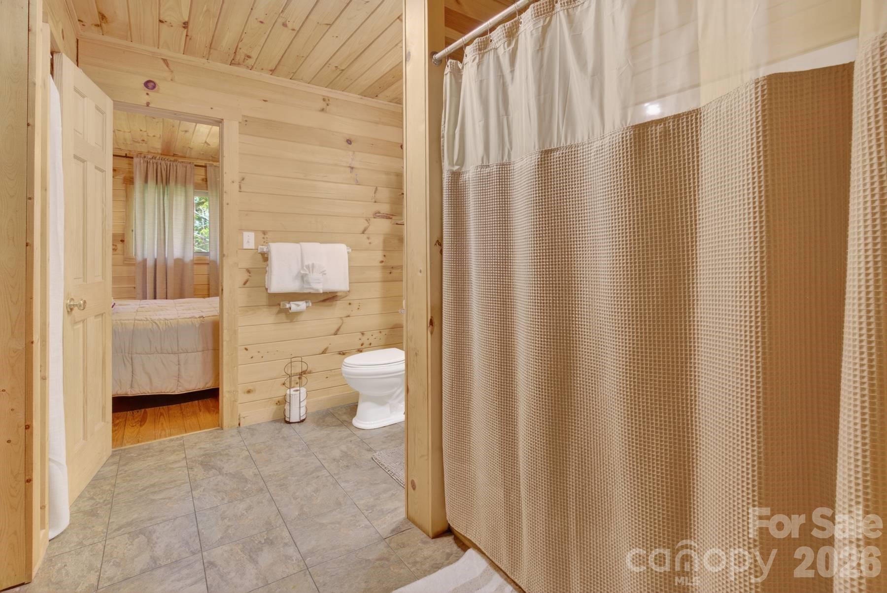 319 Blue Ridge Parkway, Unit 53 Bryson City, NC 28713 - Photo 12 of 22 a bathroom with a sink and a mirror