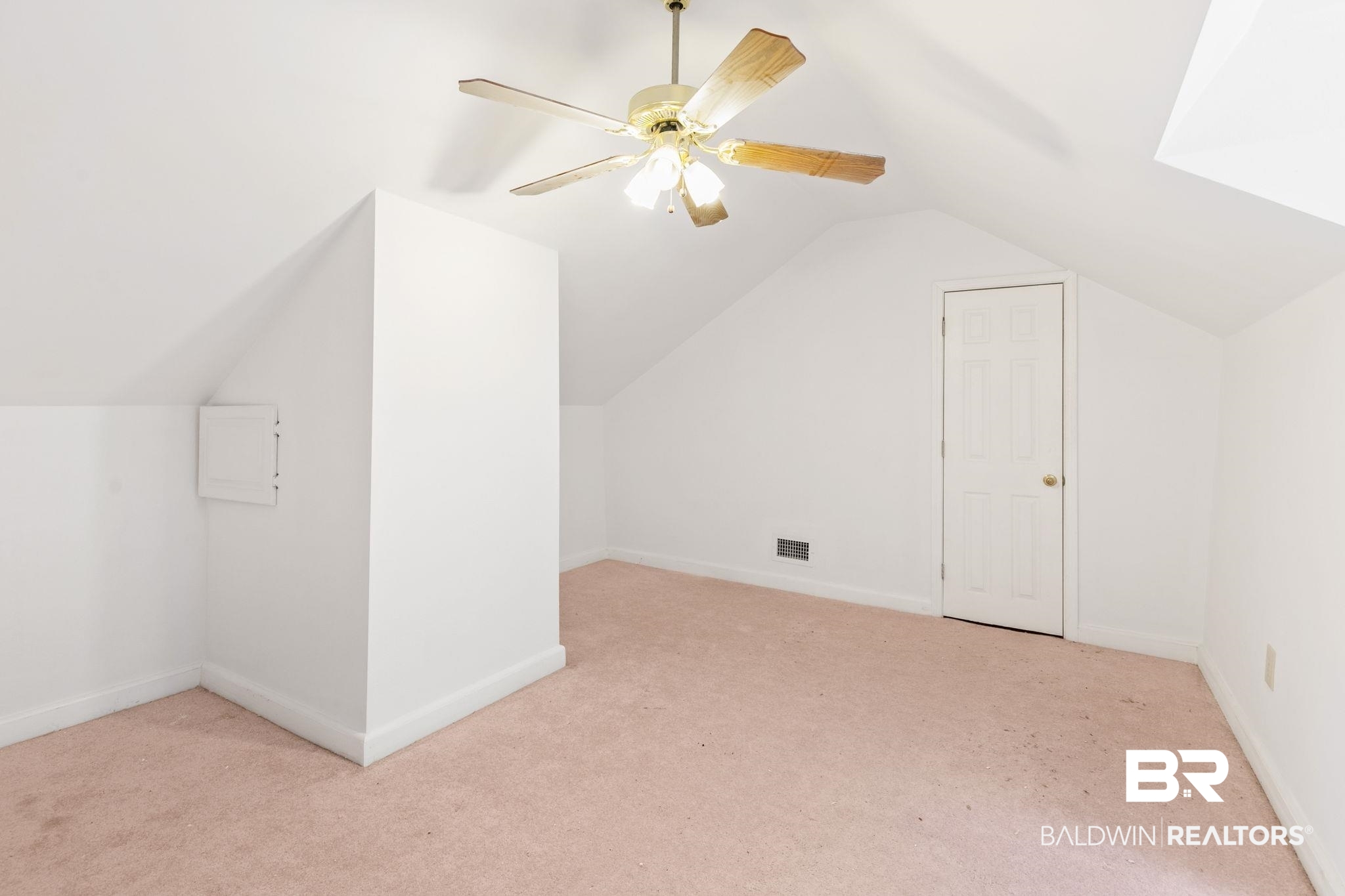 927 Cleveland Road Saraland, AL 36571 - Photo 47 of 80 Room featuring sloped ceilings, a ceiling fan with light fixture, carpeted flooring, and a white paneled door