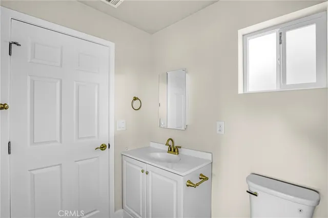 a bathroom with a sink a mirror and a shower