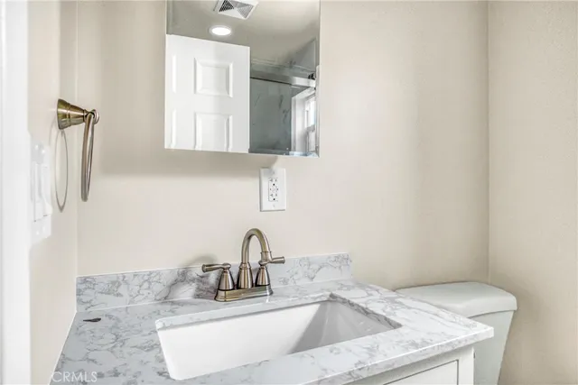 a close view of a sink and a cabinet in a bathroom