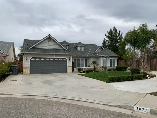 front view of a house with a garden