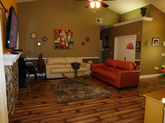 a living room with furniture and a rug