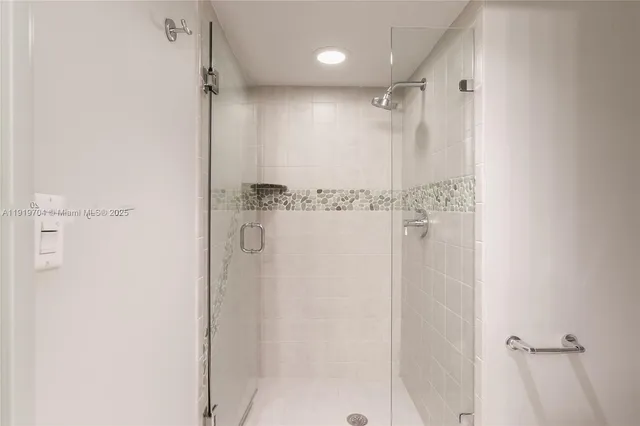 a view of a hallway with a bathroom