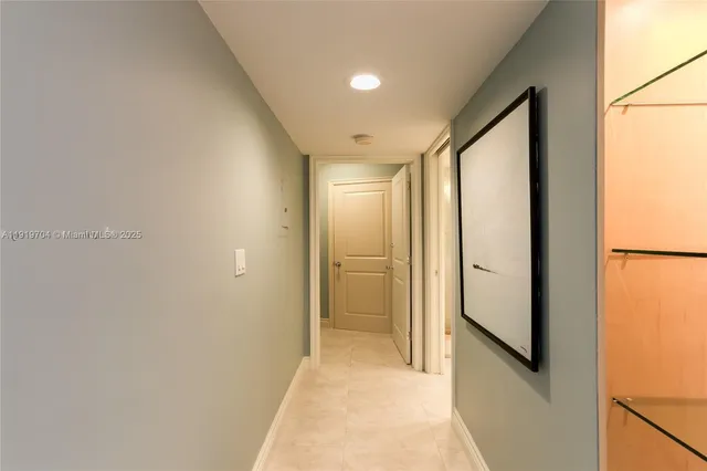 a bedroom with a bed and a lamp