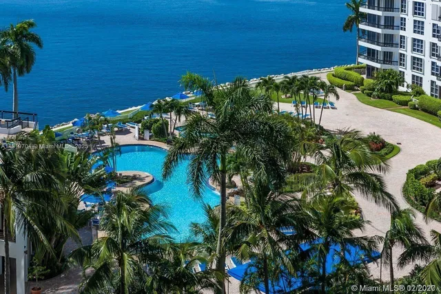 a view of a swimming pool with outdoor seating space