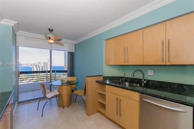 a kitchen with a stove top oven sink and refrigerator