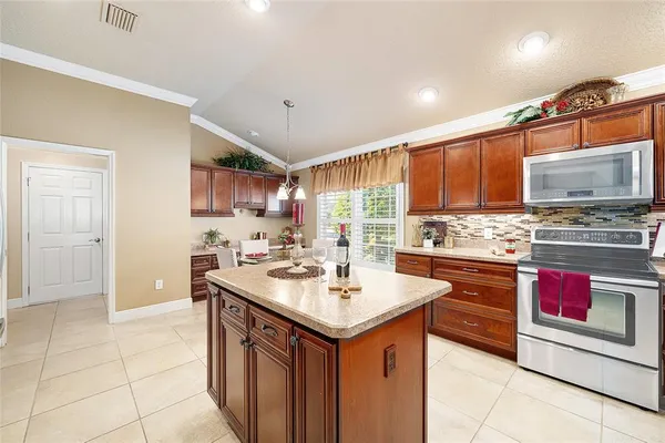 a kitchen with stainless steel appliances granite countertop a sink and cabinets