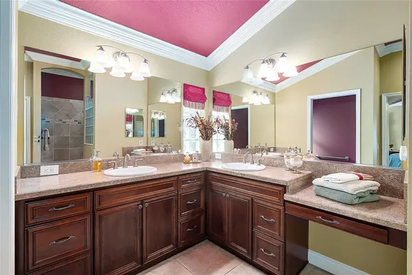 a bathroom with a sink double vanity and a mirror