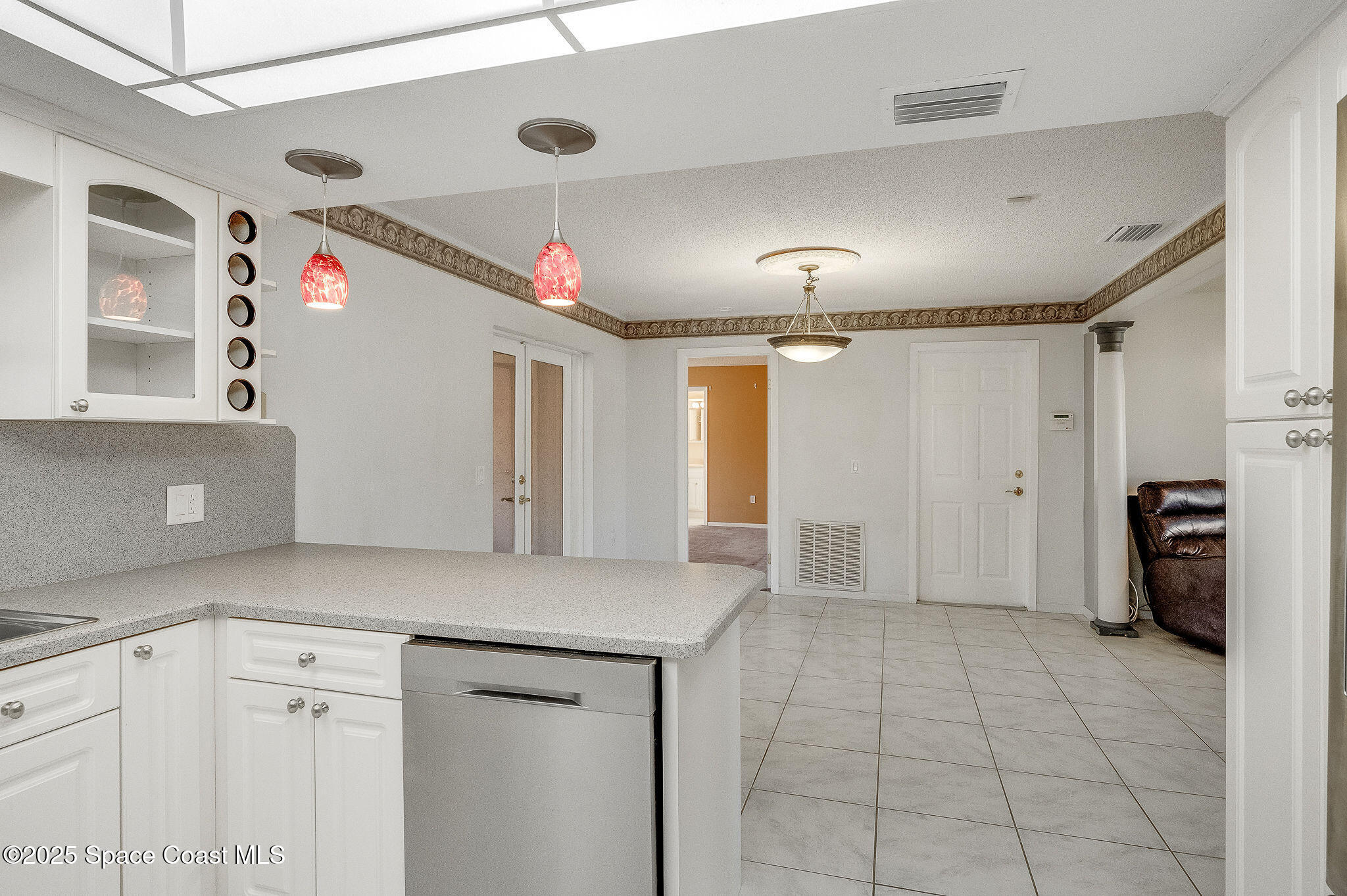 987 Sycamore Drive Rockledge, FL 32955 - Photo 18 of 48 a view of a kitchen with a cabinet and mirrors