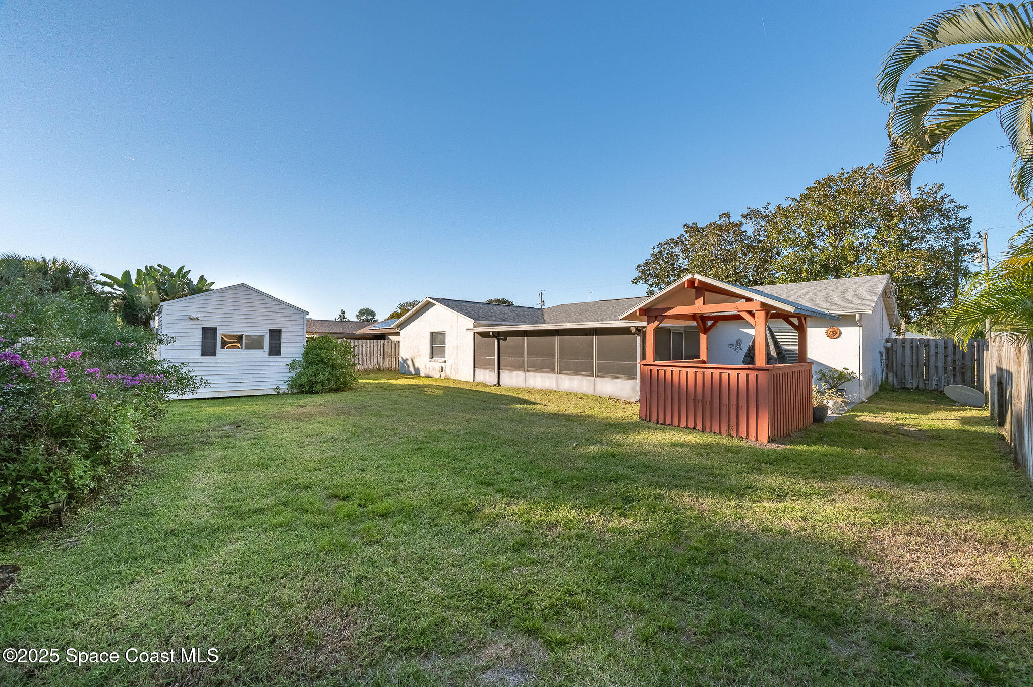 987 Sycamore Drive Rockledge, FL 32955 - Photo 33 of 48 a front view of a house with a yard