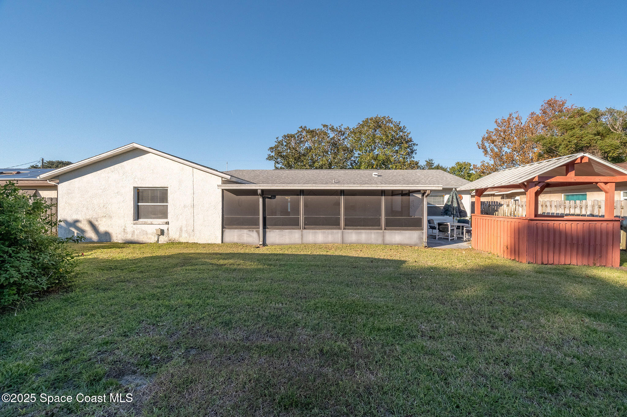 987 Sycamore Drive Rockledge, FL 32955 - Photo 34 of 48 a view of a house with a backyard