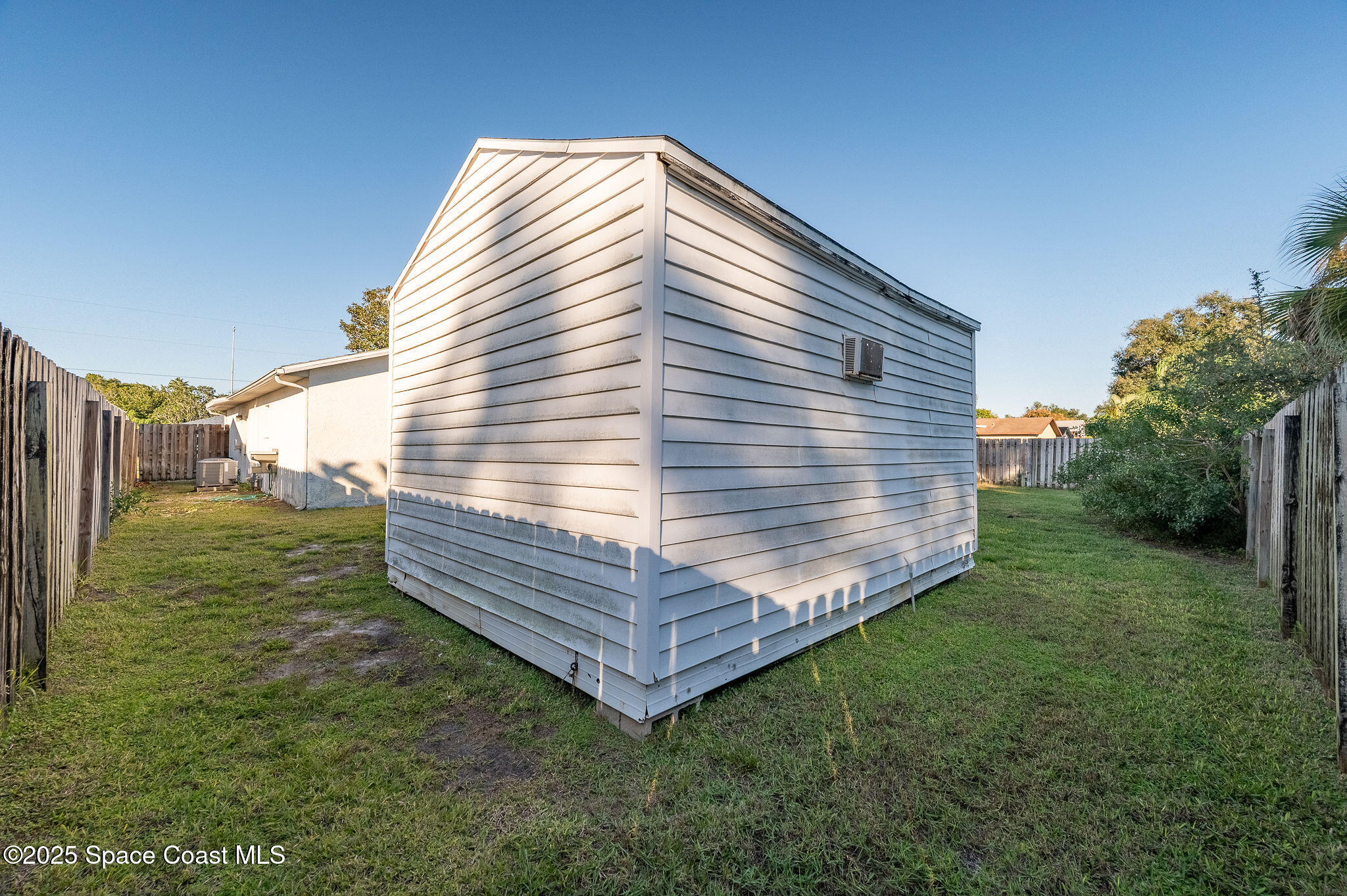 987 Sycamore Drive Rockledge, FL 32955 - Photo 38 of 48 a view of a house with a yard