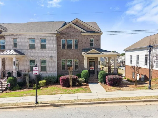 a front view of a house with a porch