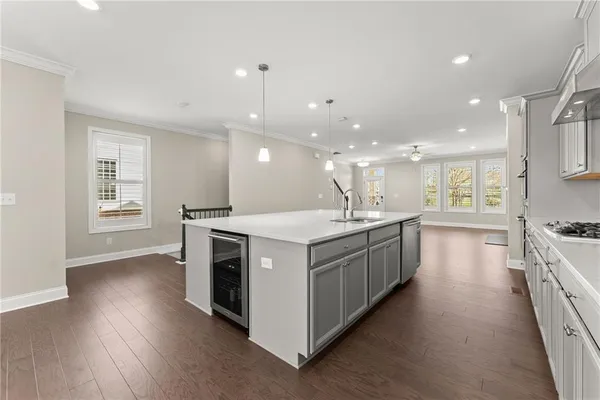a view of a kitchen with stove and cabinets