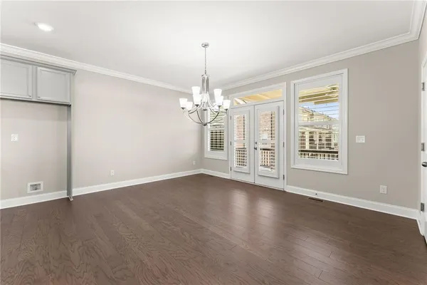 an empty room with wooden floor