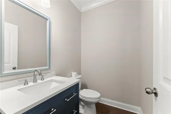 an entryway in wooden floor hall witha front door