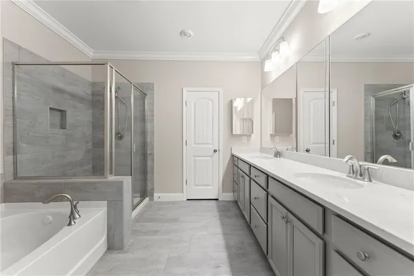 a bathroom with double sink and a mirror